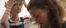 George (Marilyn Lima) looks up with Laetitia (Daisy Broom)